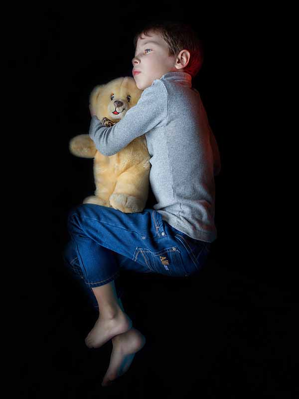 lonely child with teddy