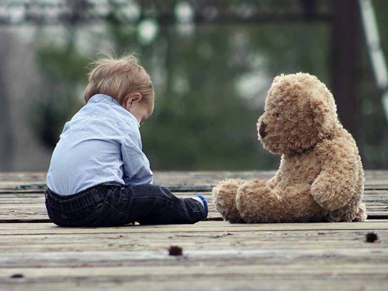 toddler with teddy